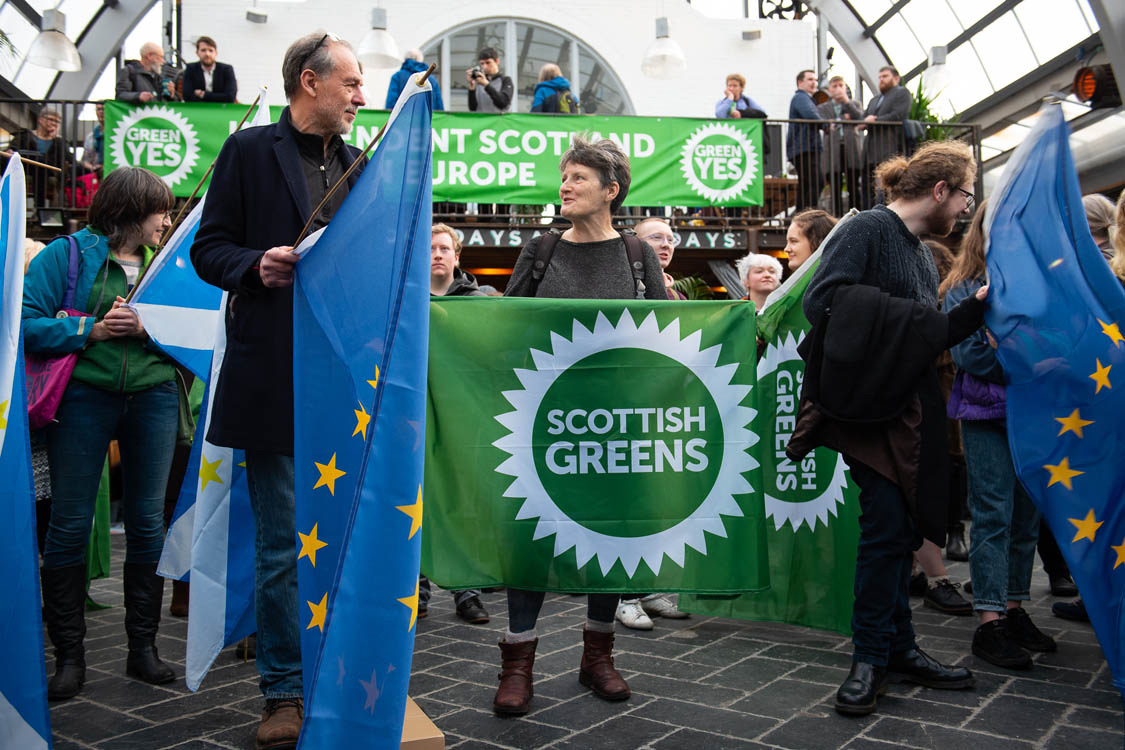 Green Yes rally with some European flags